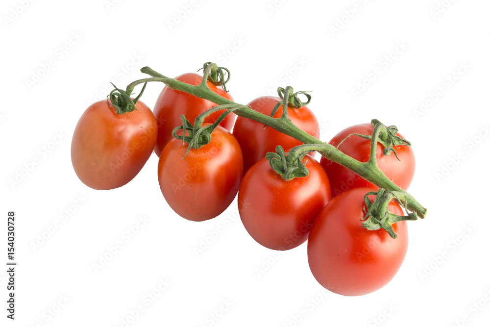 Cherry tomatoes isolated over white background close.