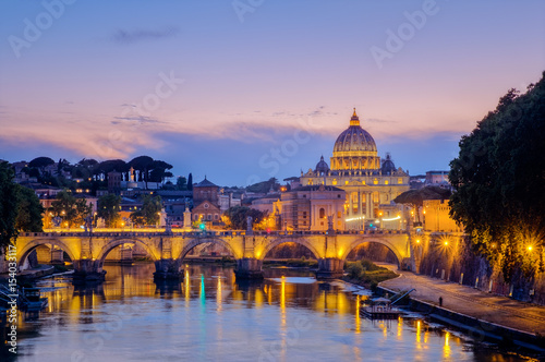 Famous citiscape view of St Peters basilica in Rome at sunset