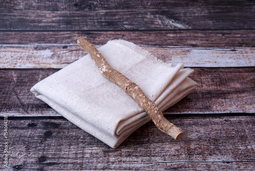 Miswak or Siwak With Sackcloth On Wooden Background. photo