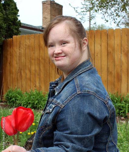 Young Woman with Down syndrome with flowers