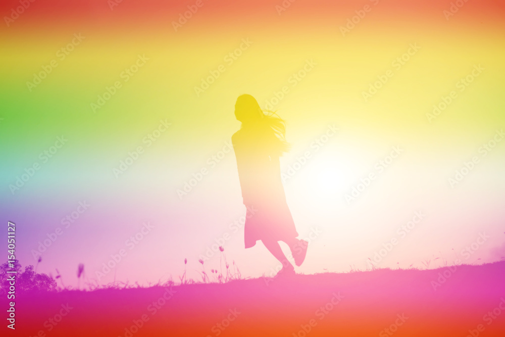 silhouette of a young woman standing alone