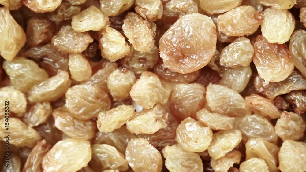 Raisin dried grape as background texture. Healthy food organic nutrition. Dolly slider shot 4K ProRes HQ codec Raisin dried grape as background texture. Healthy food organic nutrition. Dolly slider shot 4K ProRes HQ codec