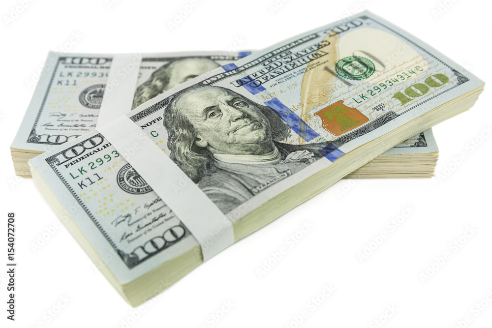 stack of one hundred dollar bill hangs over each other isolated on white background stack of one hundred dollar bill hangs over each other isolated on white background