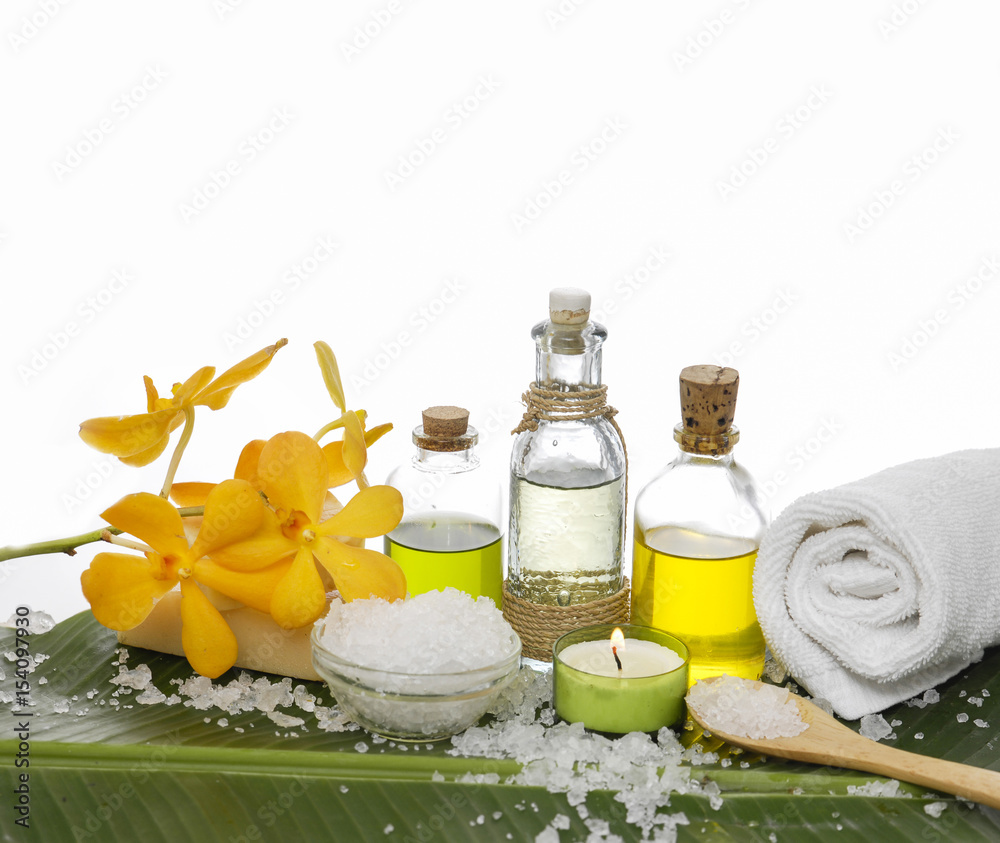 Spa set on banana leaf with oil,yellow orchid