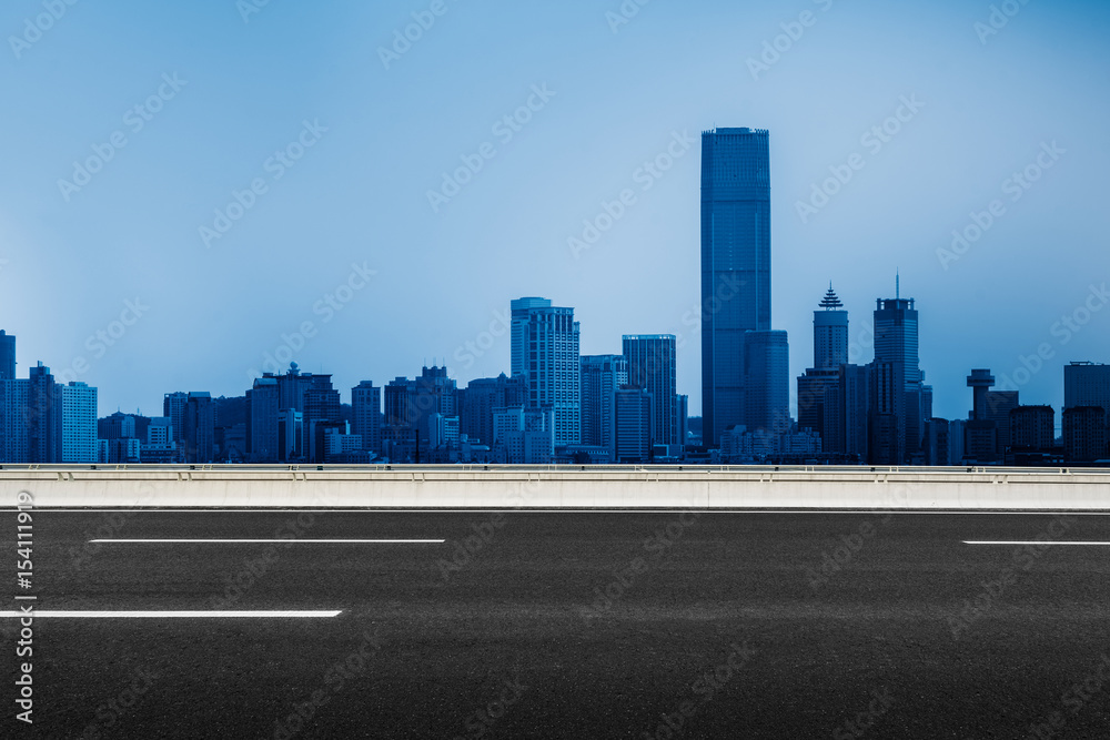 Naklejka premium City Empty Road,asphalt road through modern city in China.