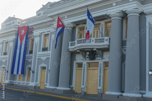 cienfuegos, cuba. City Hall with cuban and part Flags on facade during celebration of 1 january.