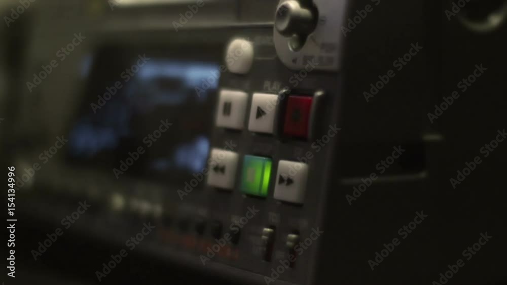 Old film camera to tape equipment blinking in video production studio Old film camera to tape equipment blinking in video production studio