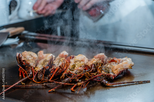 Spiny lobster cooked on grill. Teppanyaki  photo