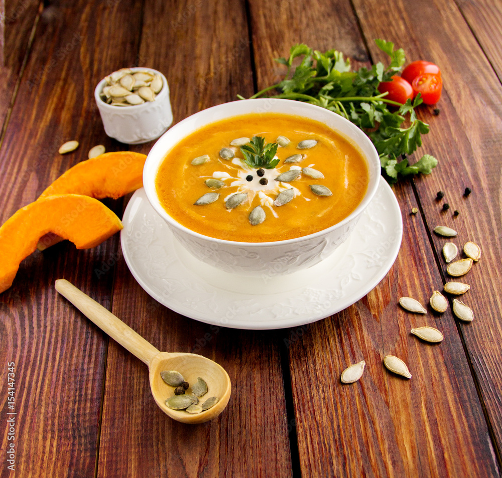Traditional Cream soup in white dish  with lid Seeds spices dill and parsley