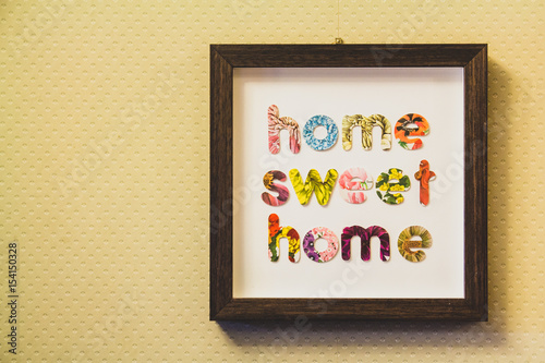 Home sweet home sign hung on a wall