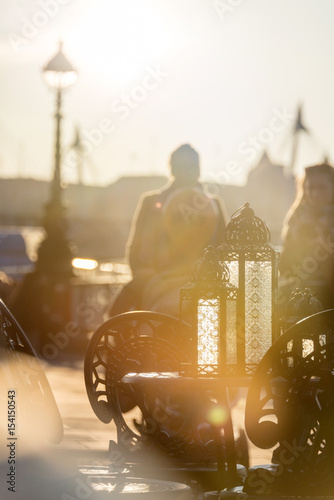 Old cafe spend free time at Thames Embankment in London