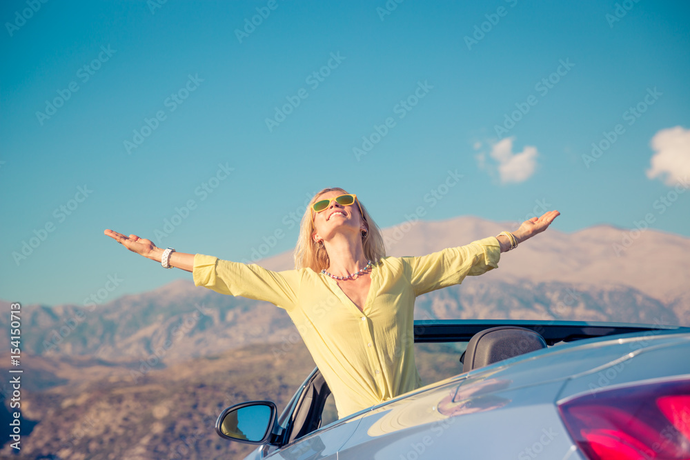 Happy woman travel by car in the mountains Happy woman travel by car in the mountains