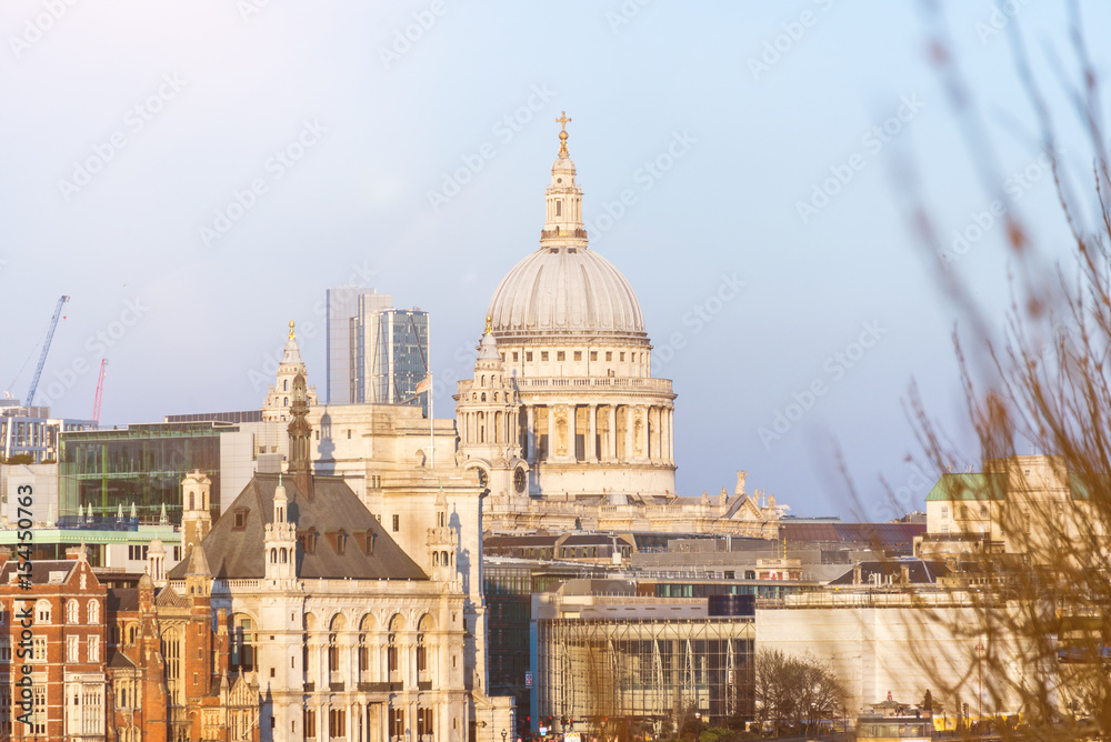 Cityscape of London with St. Paul's Cathedral against blue sky