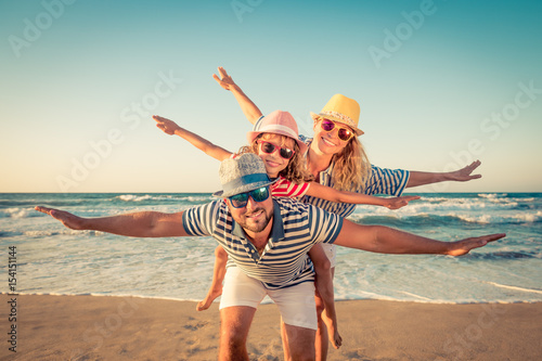 Photography Happy family having fun on summer vacation
