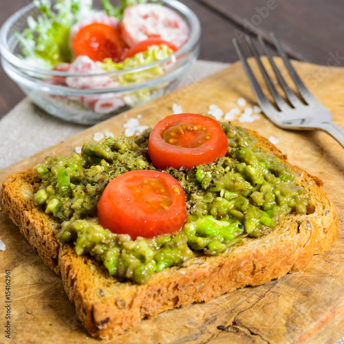 Avocado toast with whole wheat bread and vegetable salad