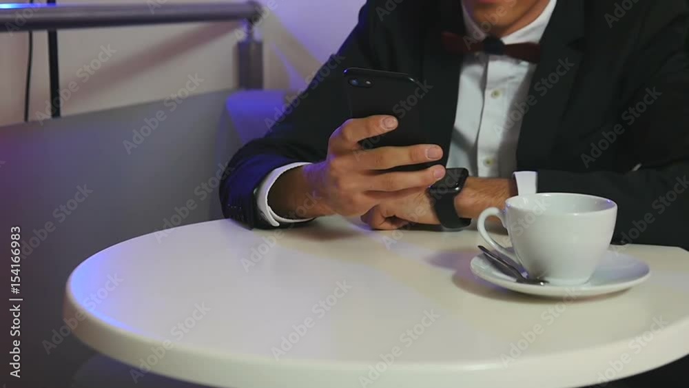 Close up of a young man using a smartphone Close up of a young man using a smartphone
