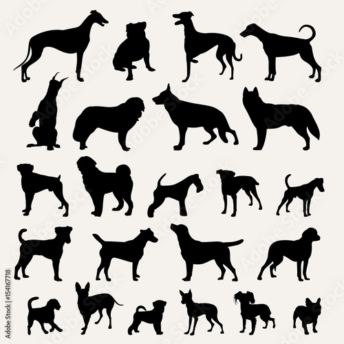 Silhouettes of dogs on a light gray background