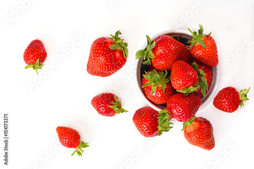 Organic fresh strawberries fruit in white cup isolate on white background