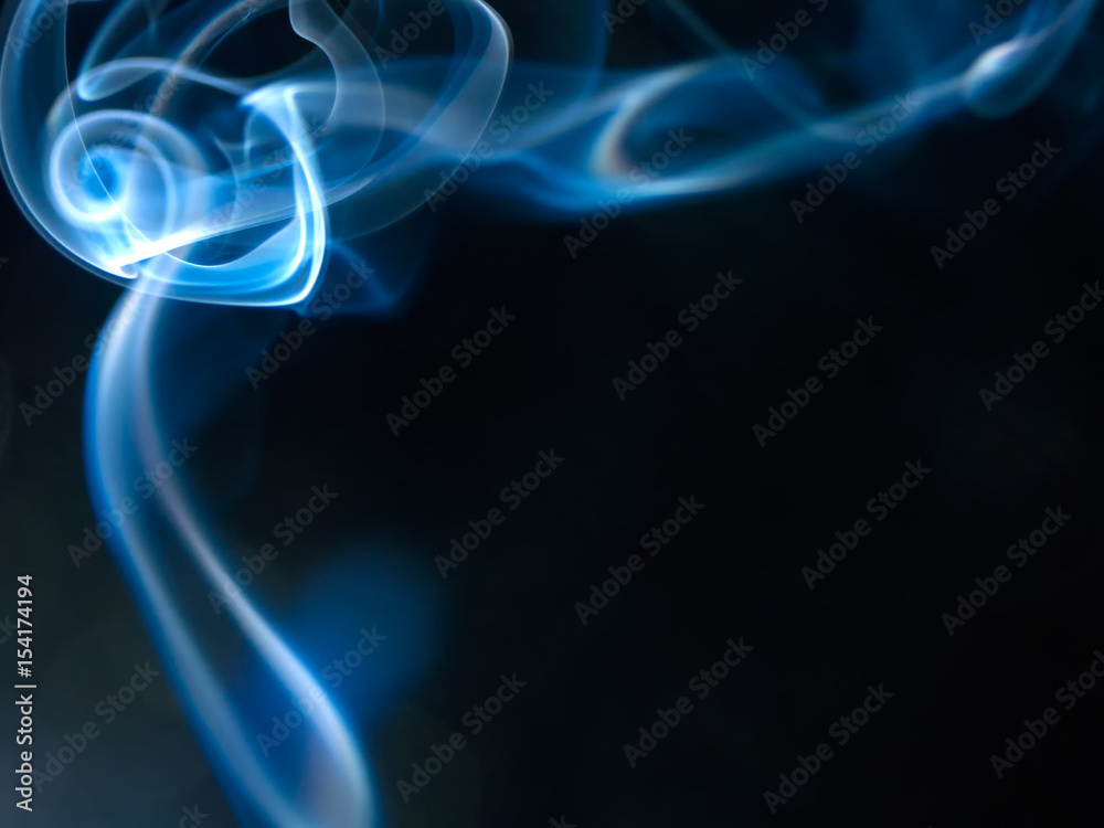 incense smoke swirling at the top incense smoke swirling at the top