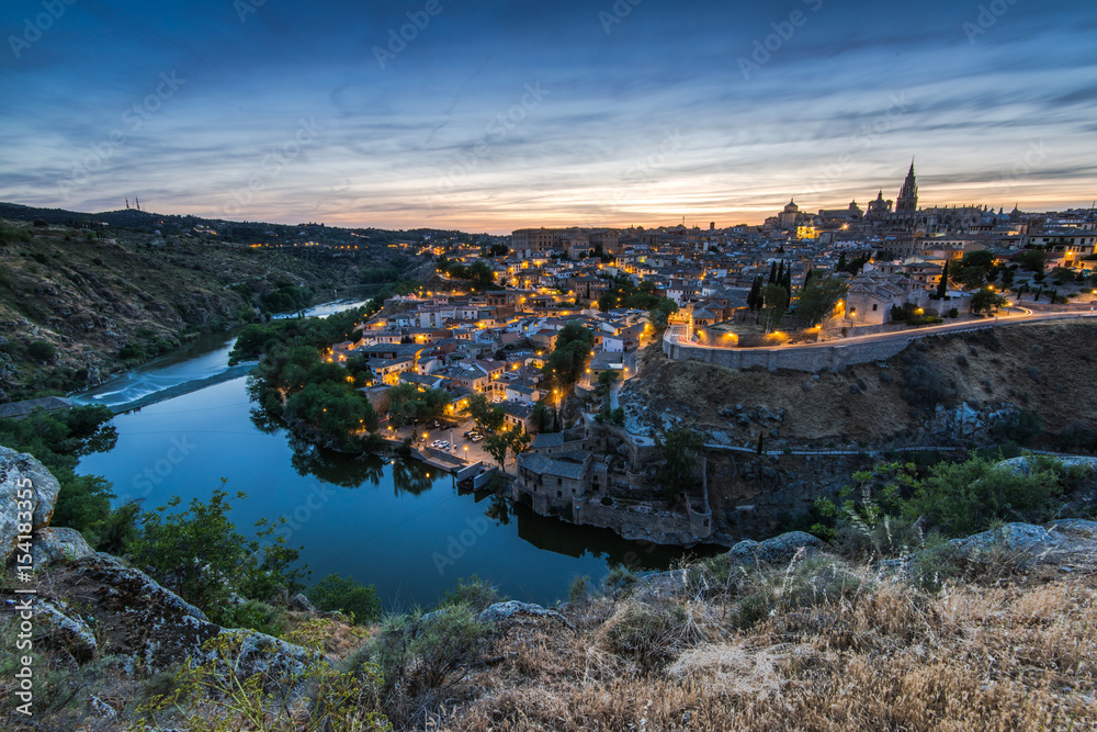 Illuminated cityscape of Toledo,Spain and river Tagus