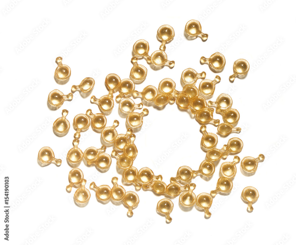 Golden capsule with cosmetic oil Golden capsule with cosmetic oil