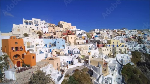 Drone flight over the artist quarter in Oia (Ia), on the Island of Santorini, Cyclades, Greece