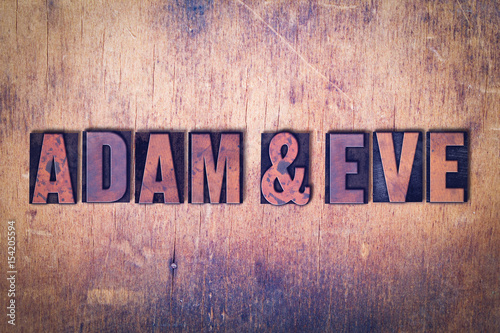Valokuvatapetti Adam and Eve Theme Letterpress Word on Wood Background