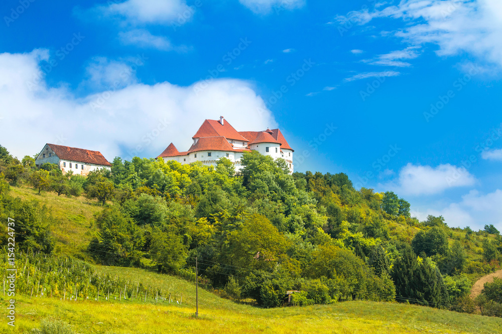     Countryside landscape in Zagorje, Croatia, with old castle Veliki Tabor on hill 
