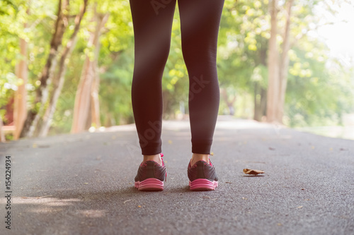 Young woman is running in sunny nature