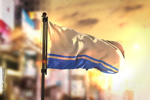Altai Republic Flag Against City Blurred Background At Sunrise Backlight