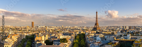 Panoramic summer view of Paris rooftops at sunset with the Eiffel Tower. 16th Arrondissement, Paris, France photo