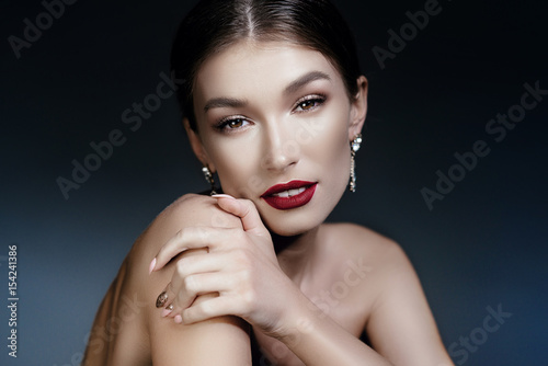 Beautiful woman with evening makeup. Jewelry and Beauty. Fashion art photo