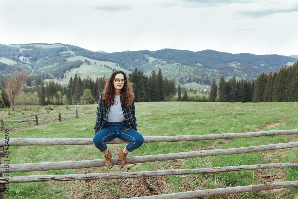 Beautiful girl travels, has a rest on the nature