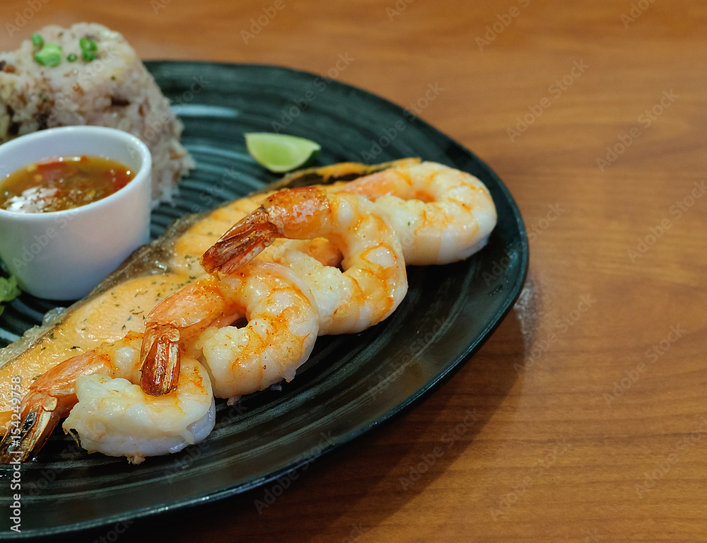 golden delicious grilled shrimp steak on black plate golden delicious grilled shrimp steak on black plate