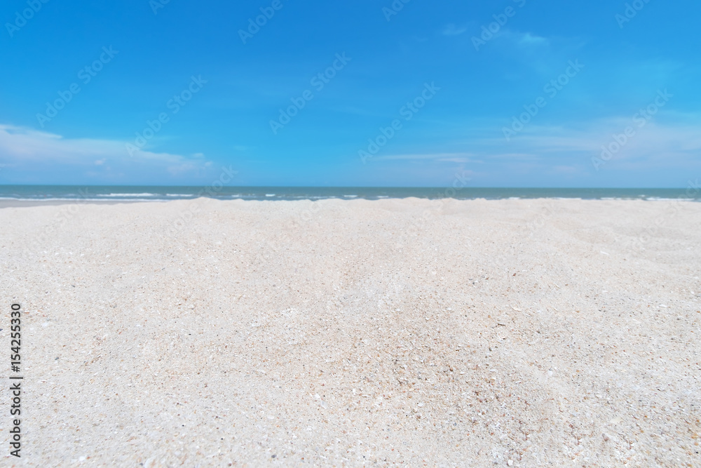close up sand beach and bright blue sky