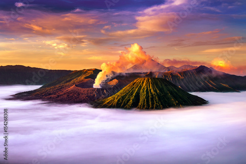 Mount Bromo volcano (Gunung Bromo) during sunrise from viewpoint on Mount Penanjakan in Bromo Tengger Semeru National Park, East Java, Indonesia. photo
