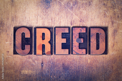 Creed Theme Letterpress Word on Wood Background
