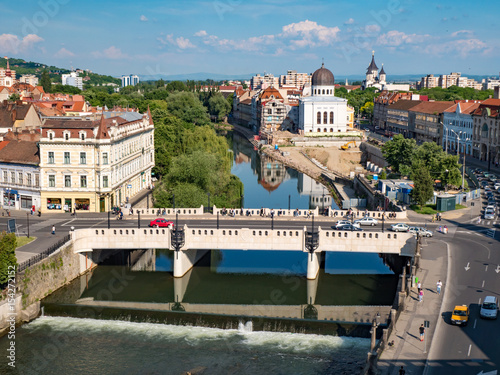 Oradea city center. Bridge over Crisul Repede river and Sion Synagogue photo