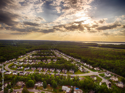 Aerial view of a Cookie Cutter Neighborhood with Sunset