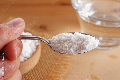 Bicarbonate on hand with spoon