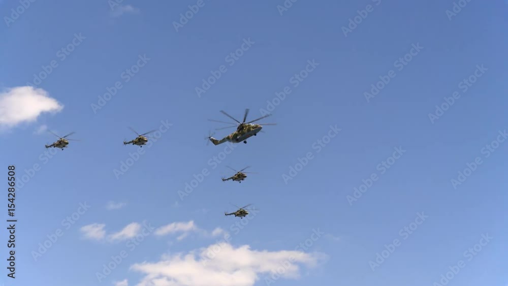 Combat helicopters Mi-26 and Mi-8 fly in sky Combat helicopters Mi-26 and Mi-8 fly in sky