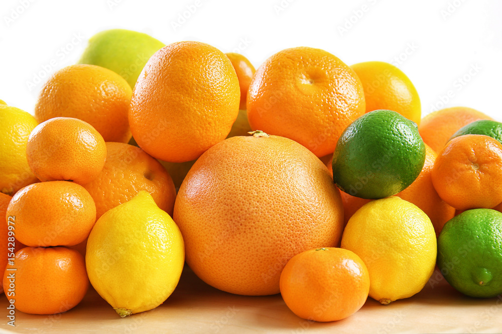 Heap of juicy citrus fruits on white background, closeup Heap of juicy citrus fruits on white background, closeup