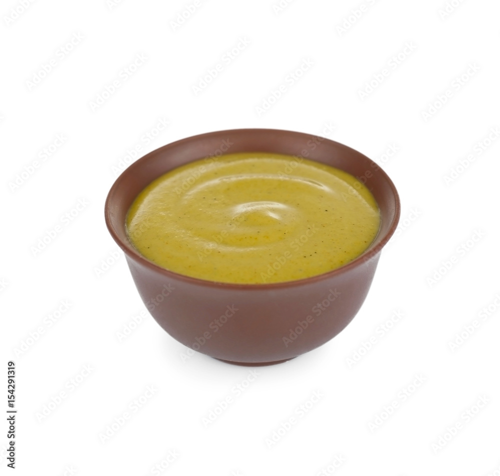Bowl of delicious mustard sauce isolated on white