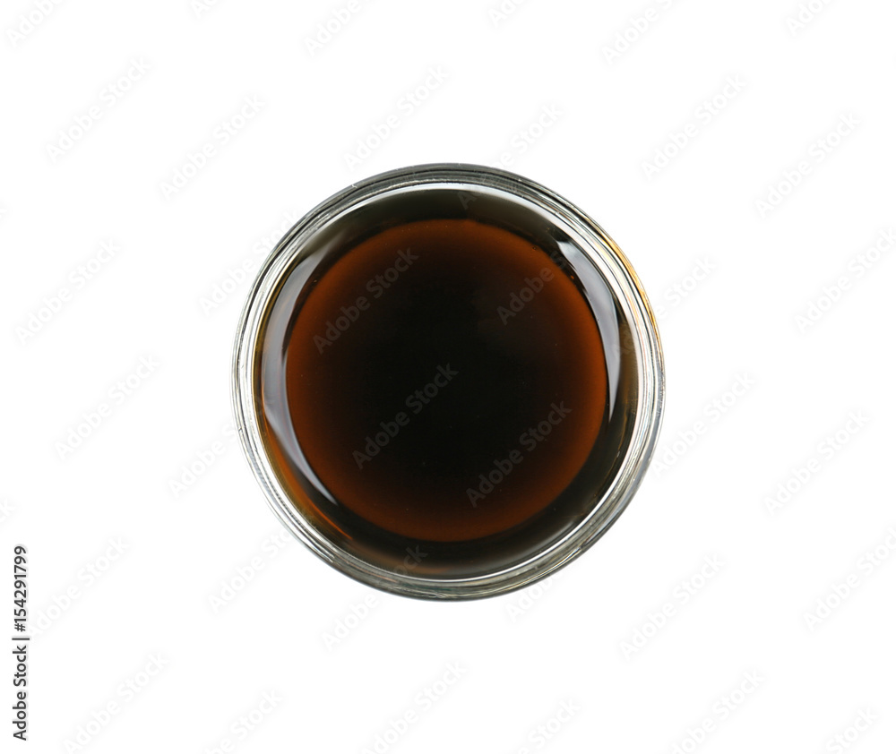 Bowl of delicious soy sauce isolated on white