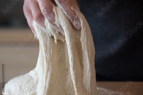 Kneading sourdough for rustic bread