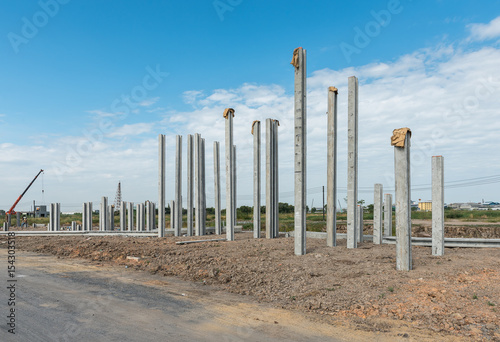 consruction site with precast concret pile and pile-driver