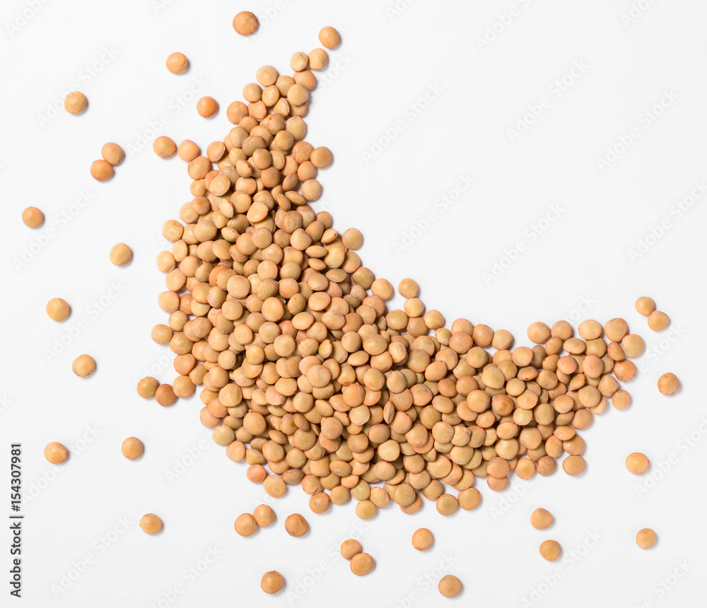 uncooked lentils on white, top view uncooked lentils on white, top view