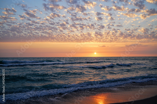 An incredible sunset over the Gulf of Mexico seen from a beach in southwest Florida.