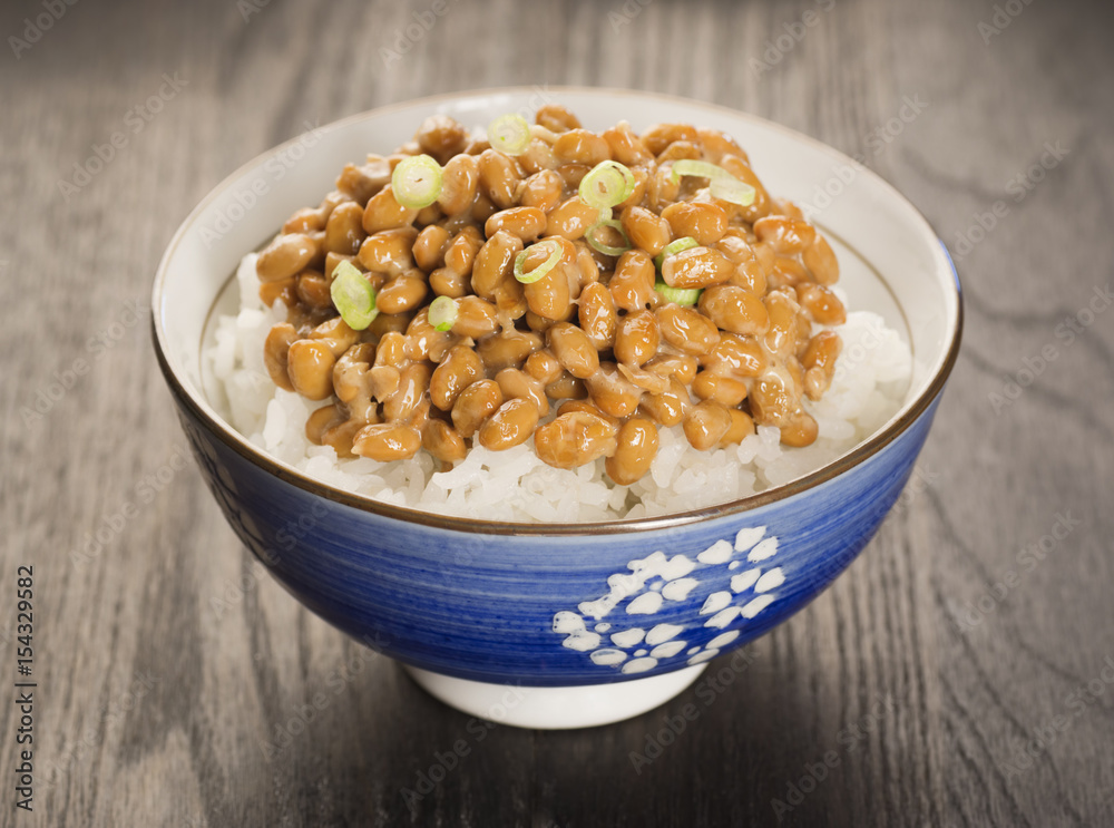 Bowl of Natto, Japanese Fermented Soybeans, over Rice with Green Onions in Bowl Bowl of Natto, Japanese Fermented Soybeans, over Rice with Green Onions in Bowl