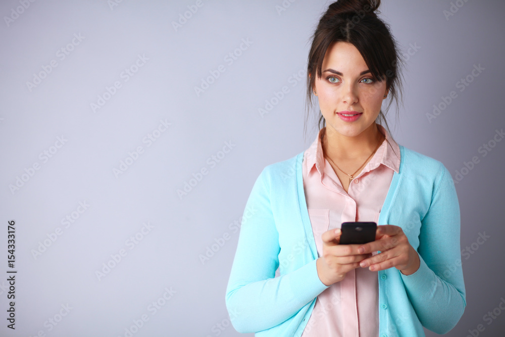 Woman using and reading a smart phone Woman using and reading a smart phone